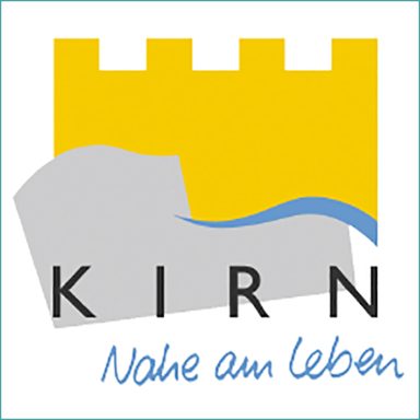 Logo der Stadt Kirn mit einem gelben Hintergrund und einer stilisierten Burg.